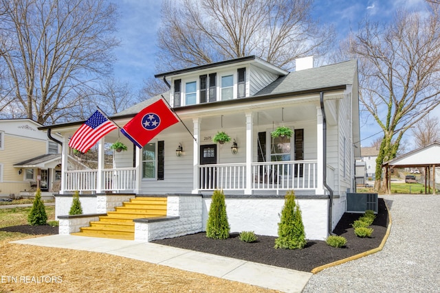 bungalow with roof with shingles, covered porch, central AC, and a chimney