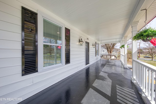 view of patio featuring a porch