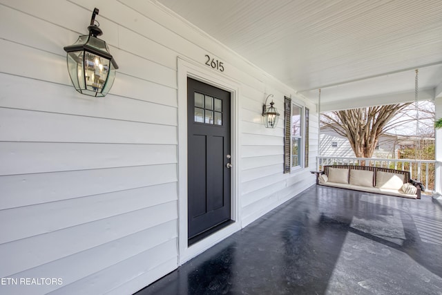 doorway to property featuring a porch