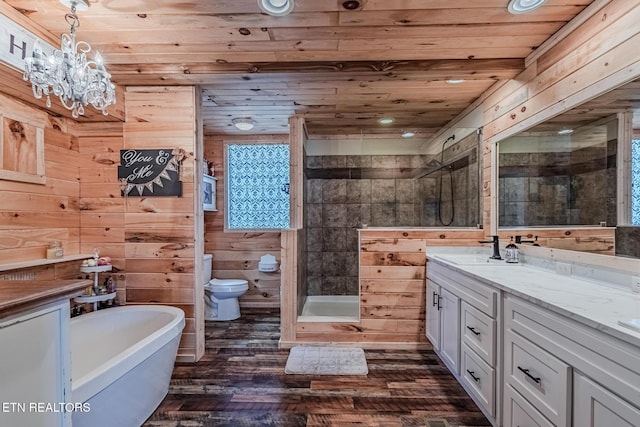 full bathroom featuring vanity, wooden walls, wood finished floors, a stall shower, and wood ceiling