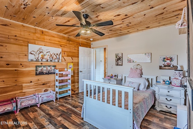 bedroom featuring a ceiling fan, dark wood finished floors, and wooden ceiling