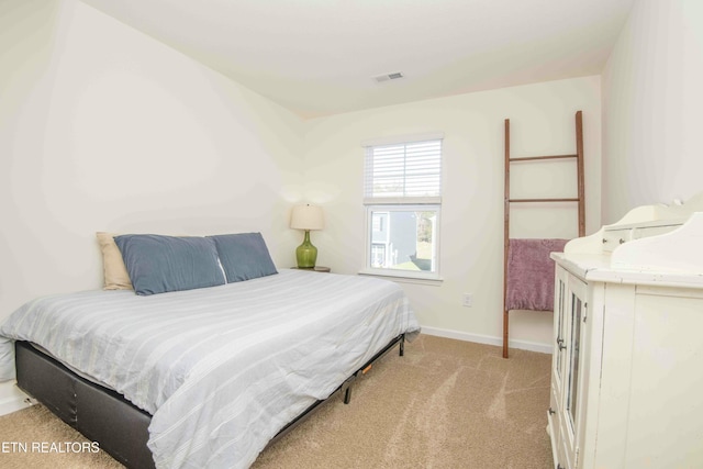 bedroom featuring visible vents, carpet, and baseboards