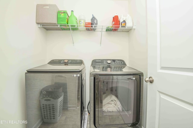 laundry room featuring washing machine and clothes dryer and laundry area