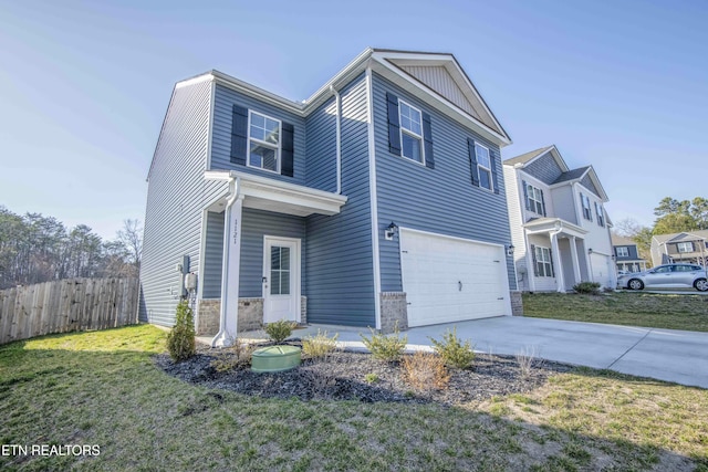 view of home's exterior with fence, a yard, a garage, stone siding, and driveway