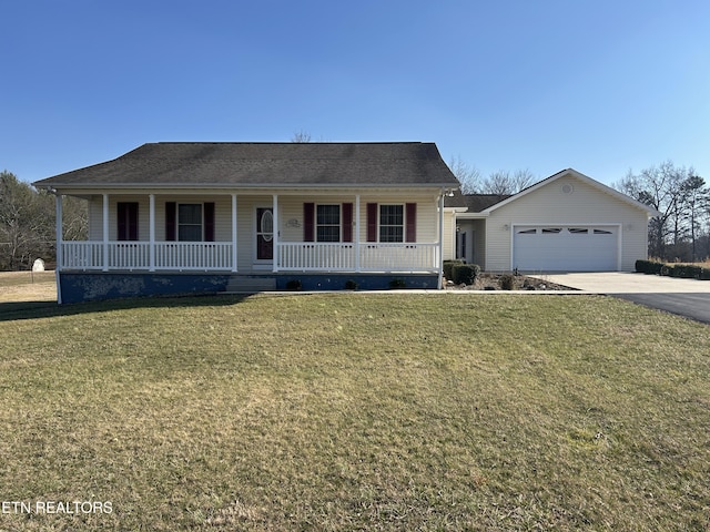 view of front of house featuring a porch, concrete driveway, a front lawn, and an attached garage