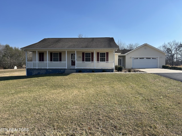 ranch-style house with a porch, an attached garage, a front yard, and driveway