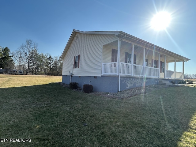 view of property exterior with crawl space, a lawn, and a porch