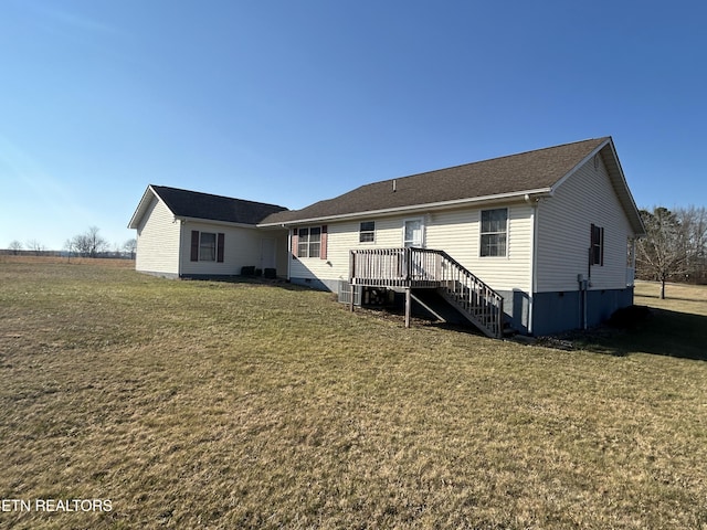 back of property with crawl space, a yard, a deck, and stairs