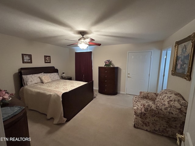 bedroom with light colored carpet and ceiling fan