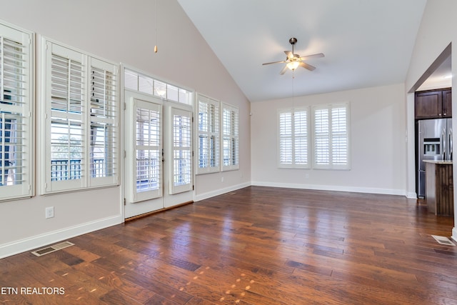 unfurnished living room featuring visible vents, baseboards, dark wood finished floors, and a ceiling fan