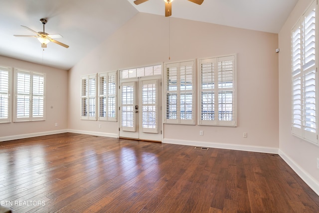 interior space with wood finished floors, a wealth of natural light, and ceiling fan