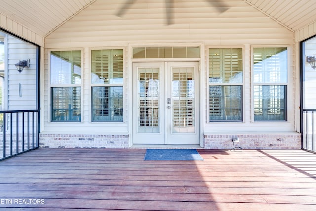 entrance to property featuring a deck and french doors