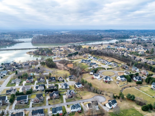 birds eye view of property featuring a water view and a residential view