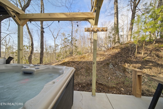 exterior space with a hot tub