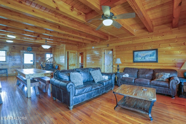 living room with light wood-style flooring and wood ceiling