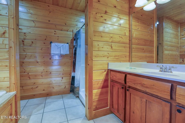 bathroom featuring tile patterned flooring, wood walls, vanity, and wood ceiling