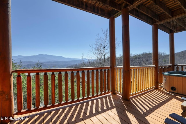 wooden terrace with a mountain view