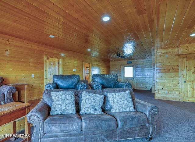 living room with a ceiling fan, recessed lighting, carpet floors, wooden ceiling, and wood walls