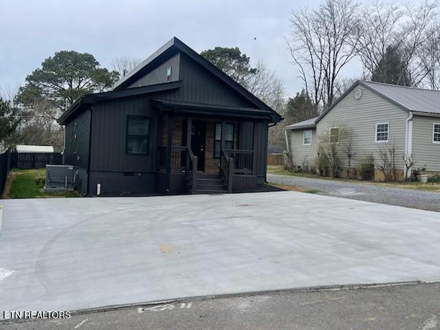 view of front of home with covered porch and crawl space