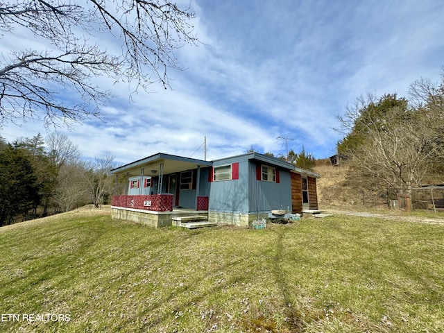 view of front of property with a front lawn and a porch