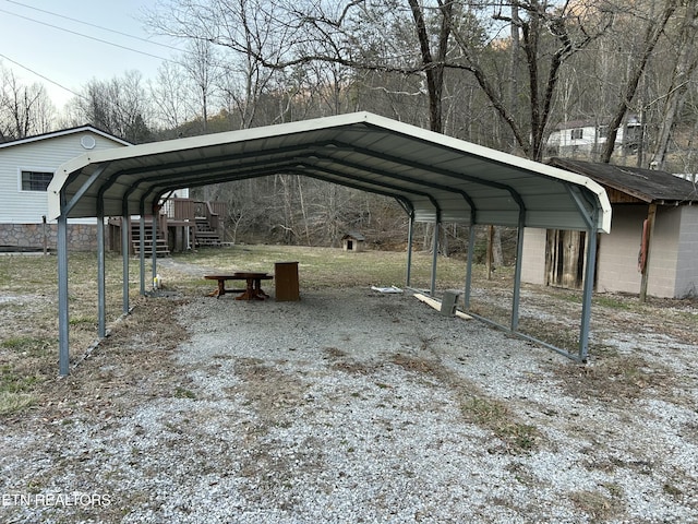 view of vehicle parking with a carport