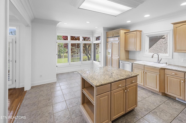 kitchen with light brown cabinetry, dishwasher, a sink, and ornamental molding