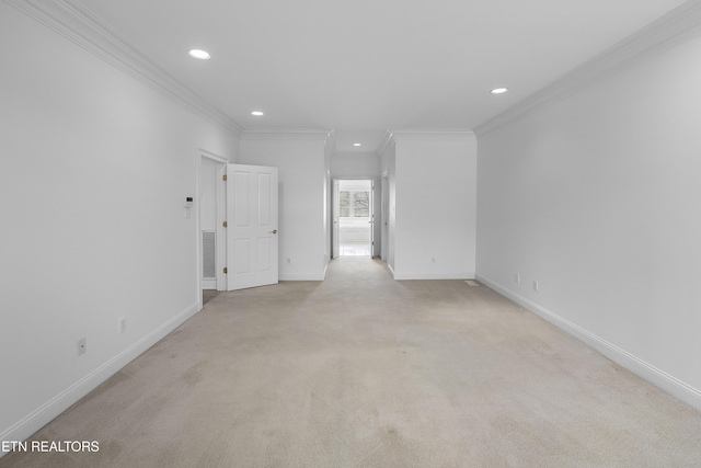 unfurnished room with crown molding, light colored carpet, baseboards, and recessed lighting