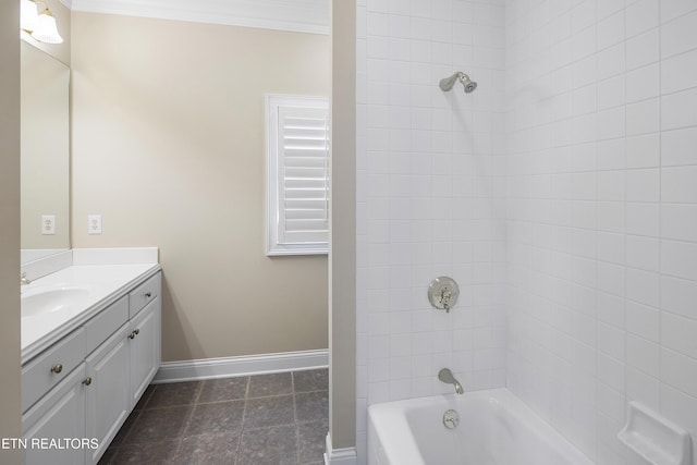 bathroom with vanity, baseboards, ornamental molding, and shower / bathing tub combination
