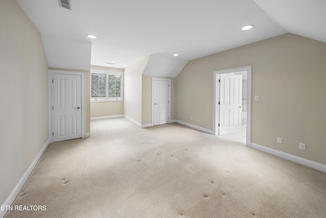 bonus room with light colored carpet, visible vents, lofted ceiling, and recessed lighting