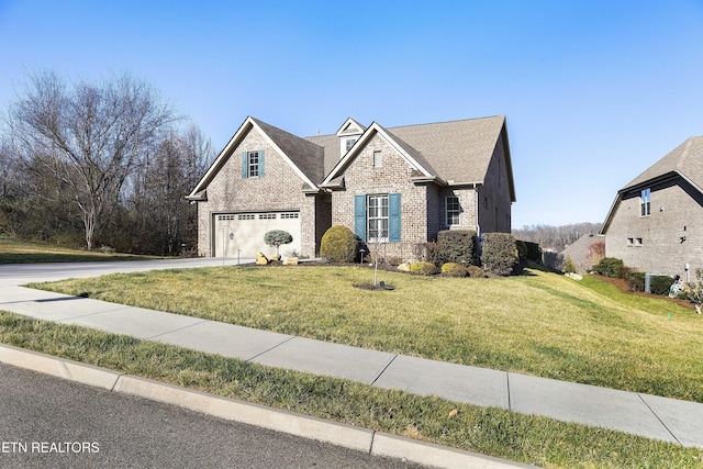 view of front of house with brick siding, roof with shingles, concrete driveway, and a front lawn