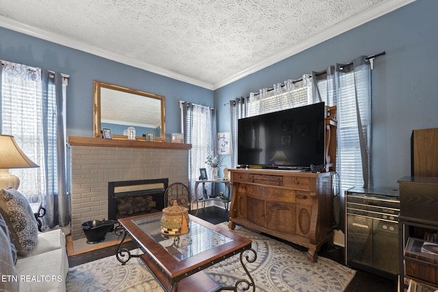 living room with crown molding, a brick fireplace, wood finished floors, and a textured ceiling