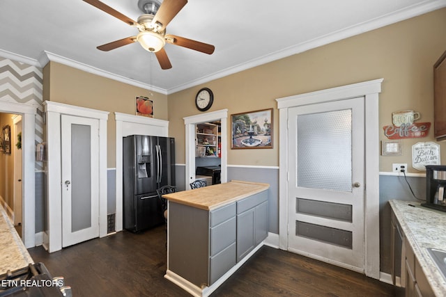 kitchen with dark wood-style floors, a peninsula, ornamental molding, light countertops, and refrigerator with ice dispenser