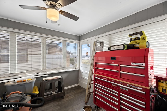 misc room featuring baseboards, wood finished floors, and a ceiling fan