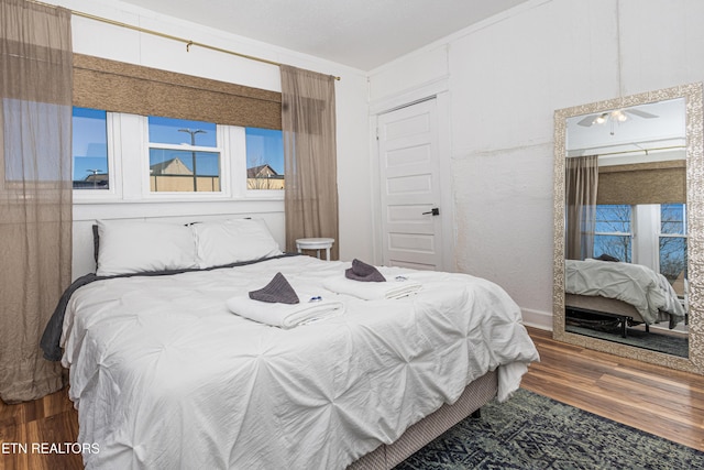 bedroom featuring a closet and wood finished floors