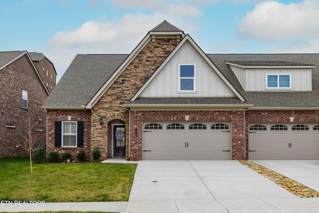 view of front of property featuring brick siding, roof with shingles, concrete driveway, and a front yard