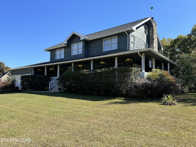 country-style home featuring a garage, a chimney, covered porch, and a front lawn