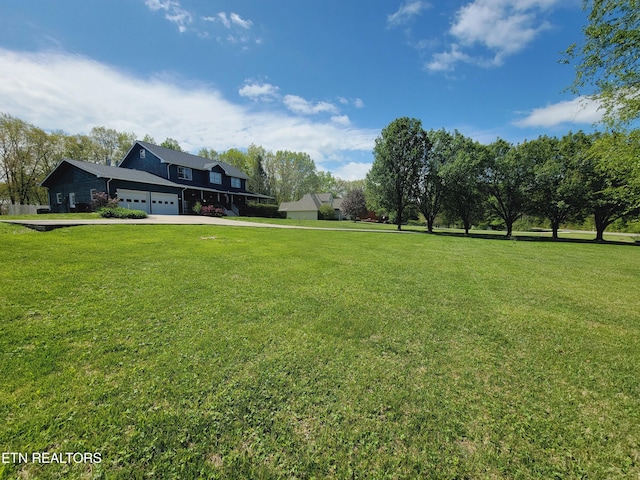 view of yard with a garage