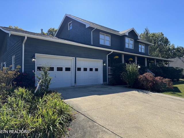 view of front of home featuring a garage and driveway