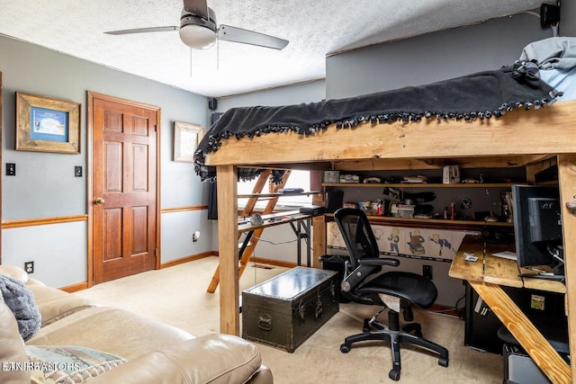 bedroom with carpet flooring, a textured ceiling, and baseboards