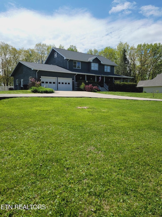 view of front of home with a front yard and driveway