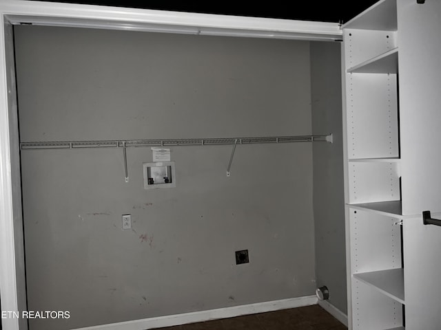 clothes washing area featuring washer hookup, laundry area, baseboards, and hookup for an electric dryer