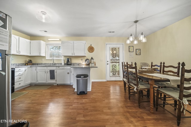 kitchen featuring a sink, dark wood-style flooring, white cabinets, and white dishwasher