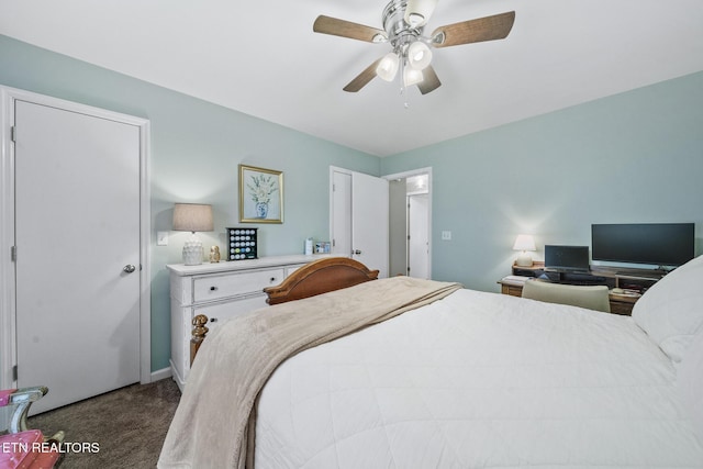 carpeted bedroom with a ceiling fan