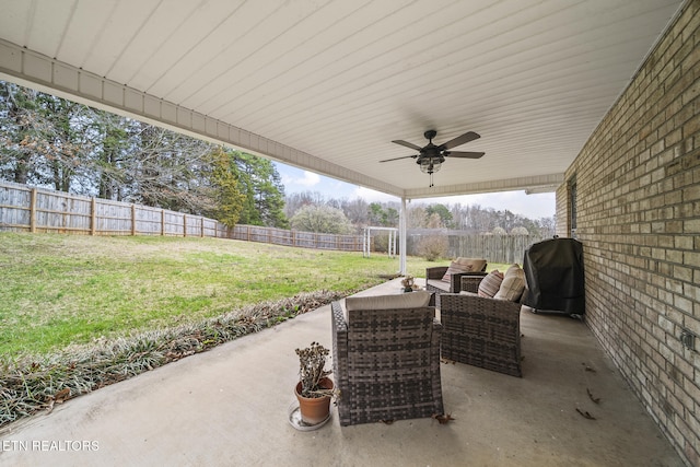 view of patio / terrace with a grill, a fenced backyard, and a ceiling fan