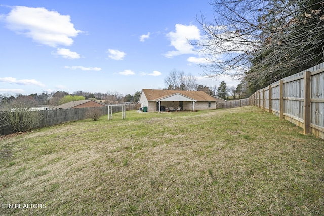 view of yard with a fenced backyard