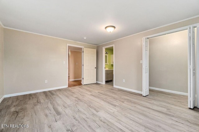 unfurnished bedroom with light wood finished floors, baseboards, and ornamental molding