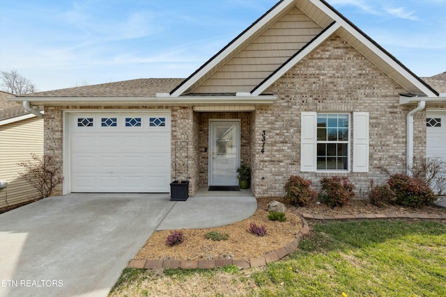 view of front of house featuring brick siding, an attached garage, driveway, and roof with shingles