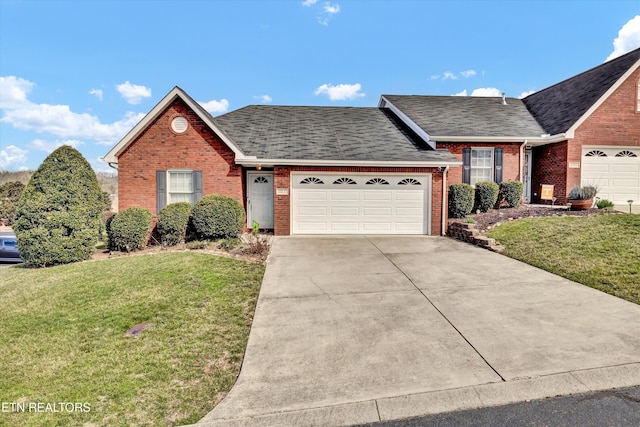 ranch-style house with a front yard, brick siding, and an attached garage