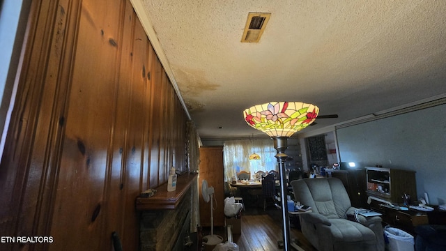 interior space featuring visible vents and a textured ceiling