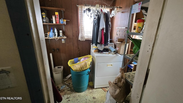 laundry area with laundry area, wooden walls, and washer / clothes dryer